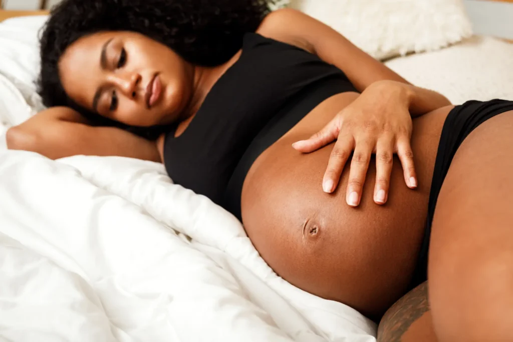 close up of pregnant woman touching her belly 2023 09 04 22 31 08 utc
